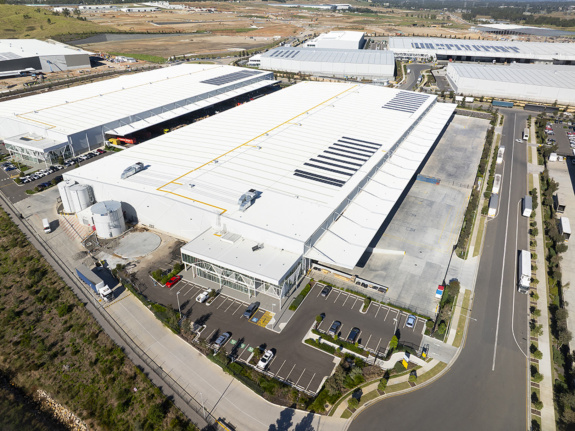 Aerial view of the TWL Kemps Creek facility in Sydney, showing the warehouse roof, solar array and truck yard
